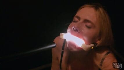 Filthy closeup of submissive whore playing with frozen cum