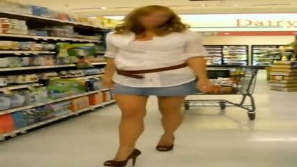 Stunning Blonde Loves Wearing Short Jeans Skirt And High Heels While Buying Groceries