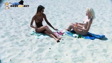 Beautiful blonde nudist sunbathe her trimmed pussy