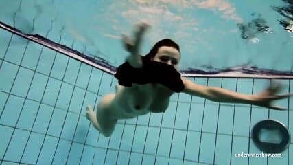 Big tits Kristy naked swimming pool action